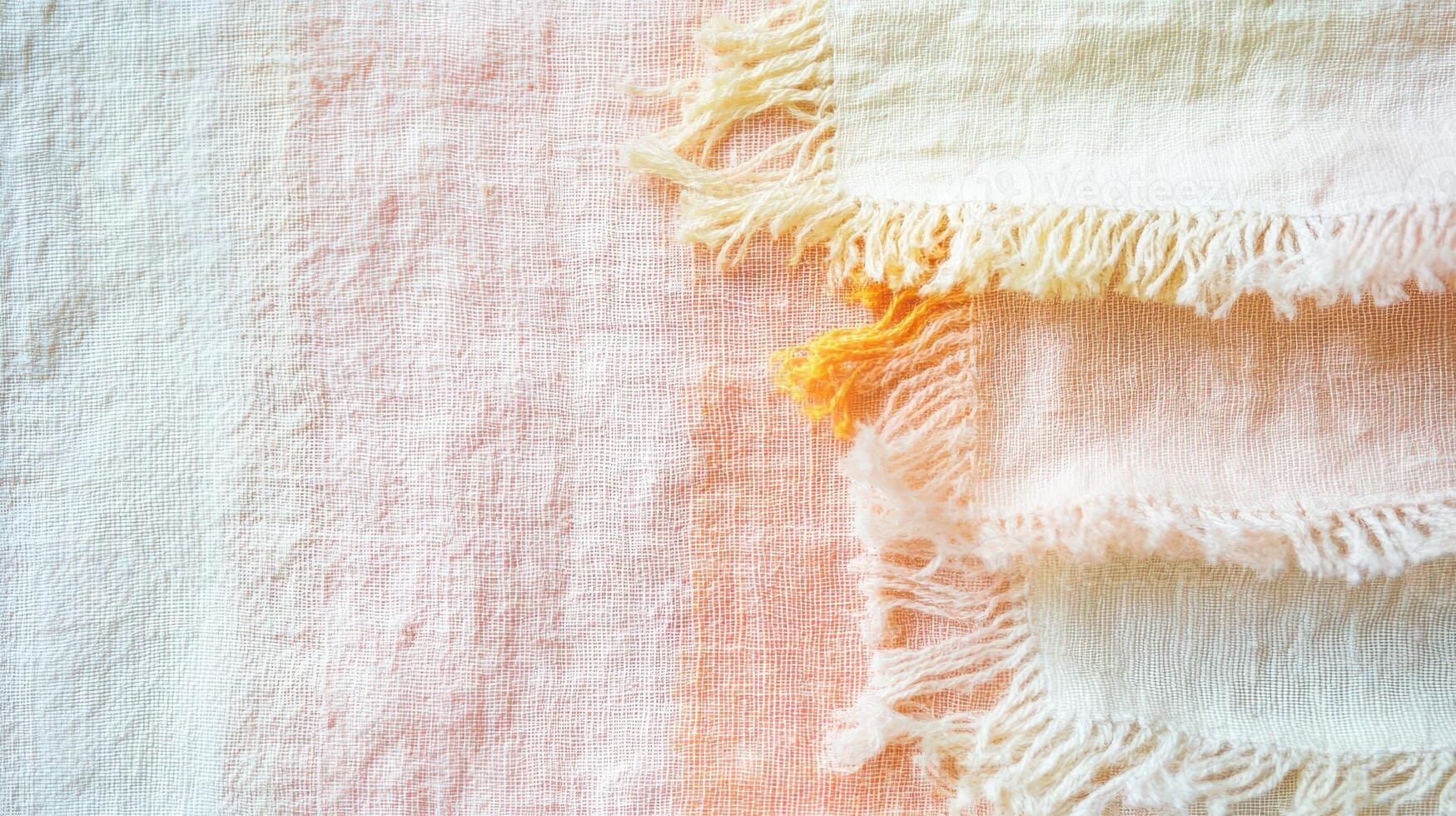 Frayed patterned textile arrangement photo