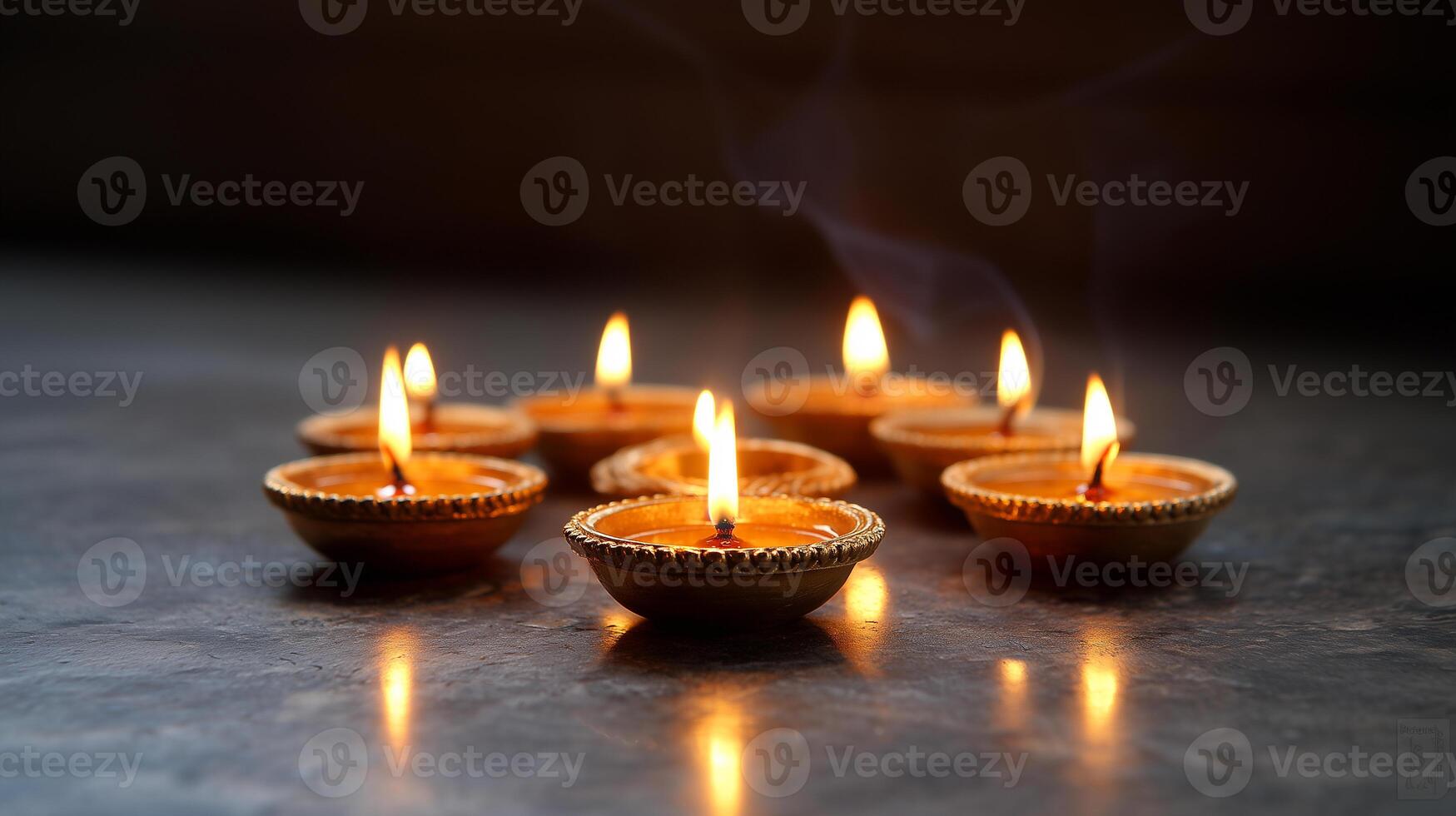 Warm Light Reflection from Multiple Lit Oil Lamps Darkness photo