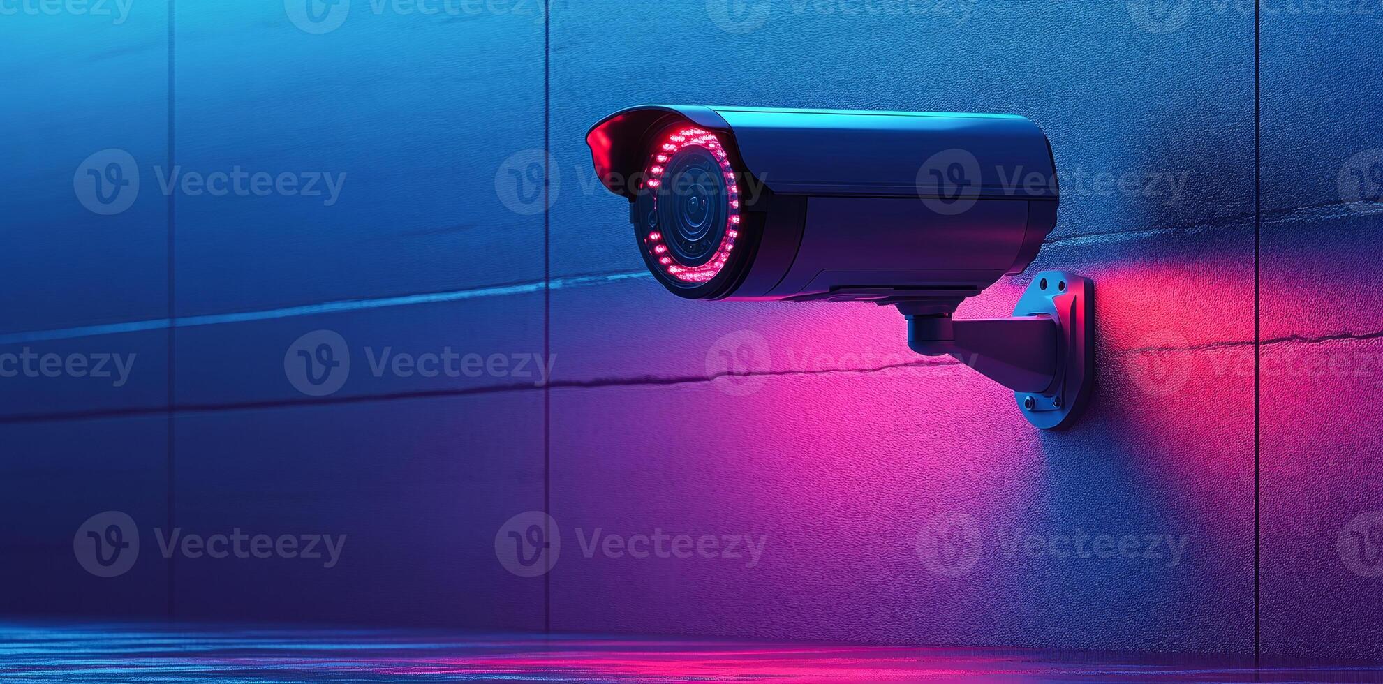 Security camera in neon-lit environment. Modern security camera mounted on wall emits red light in a neon-lit setting, enhancing safety and surveillance. photo
