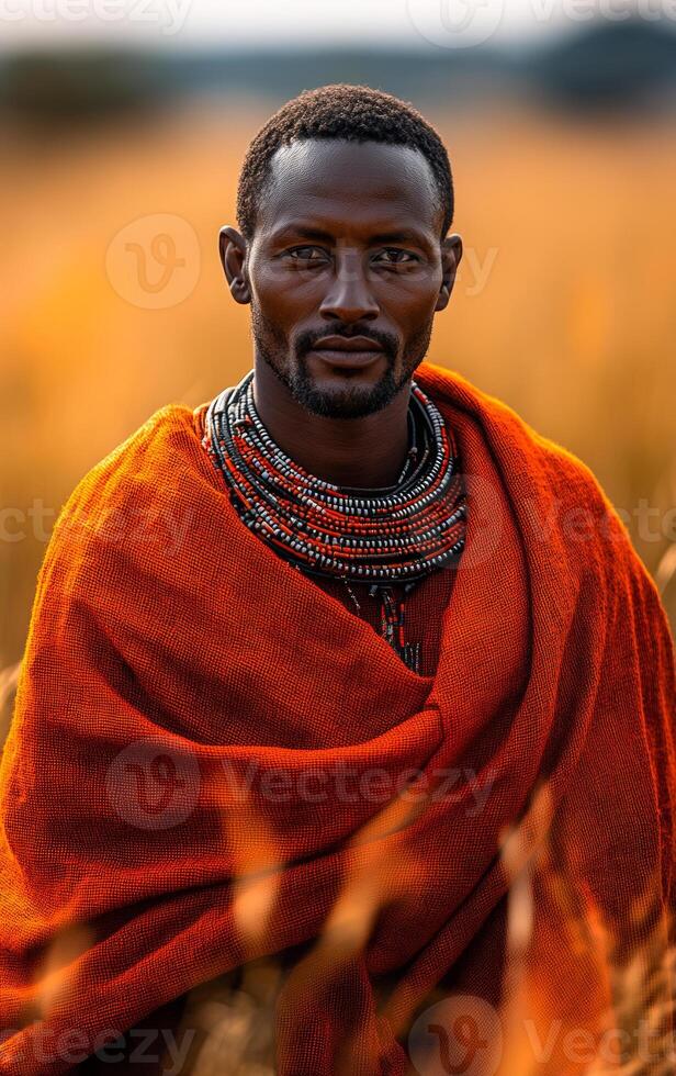 Portrait of a man in traditional attire. A man stands confidently in a golden field wearing vibrant traditional clothing and intricate beaded jewelry. photo
