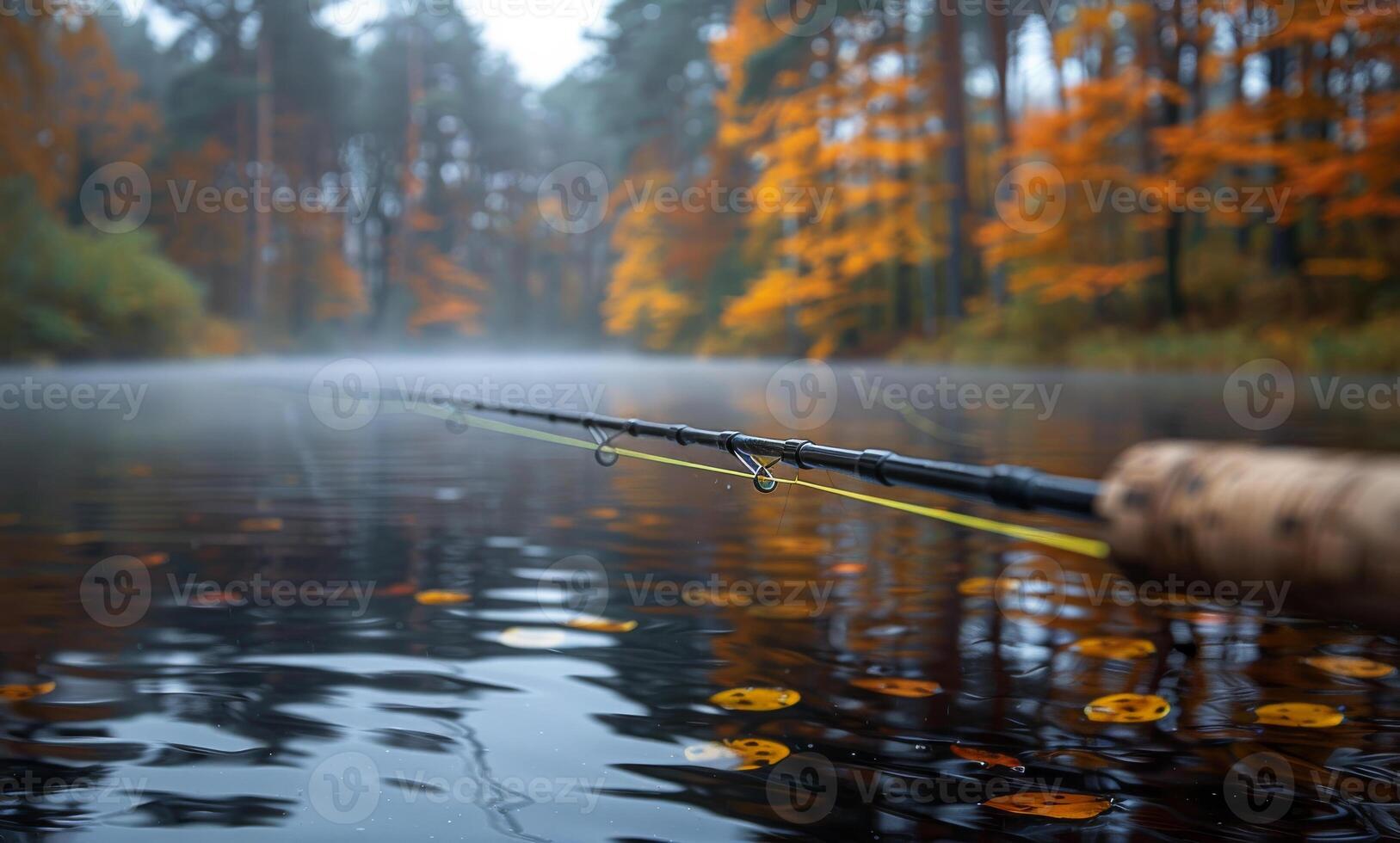 Fishing in a tranquil autumn forest. A fisherman casts a line into a calm river surrounded by vibrant autumn foliage, creating a peaceful atmosphere. photo