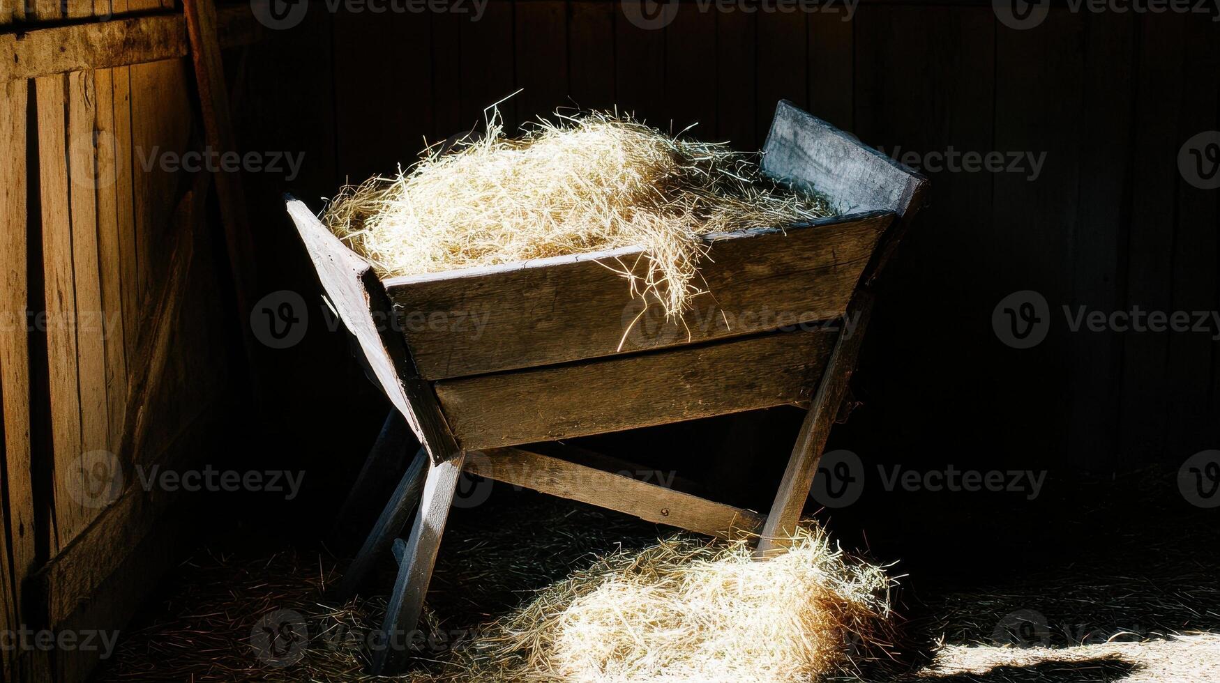 Manger Scene Rustic Wooden Trough Filled with Hay in a Dark Barn a Symbol of Humility and New Beginnings photo