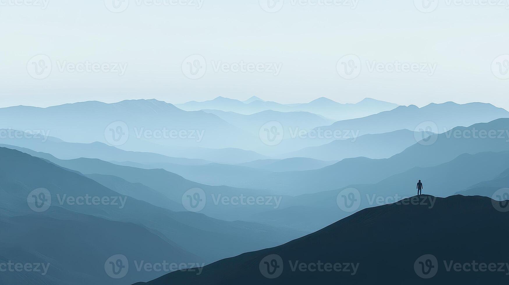 Silhouette on the Summit A Solitary Figure Amidst Misty Mountain Layers Contemplation and Serenity photo
