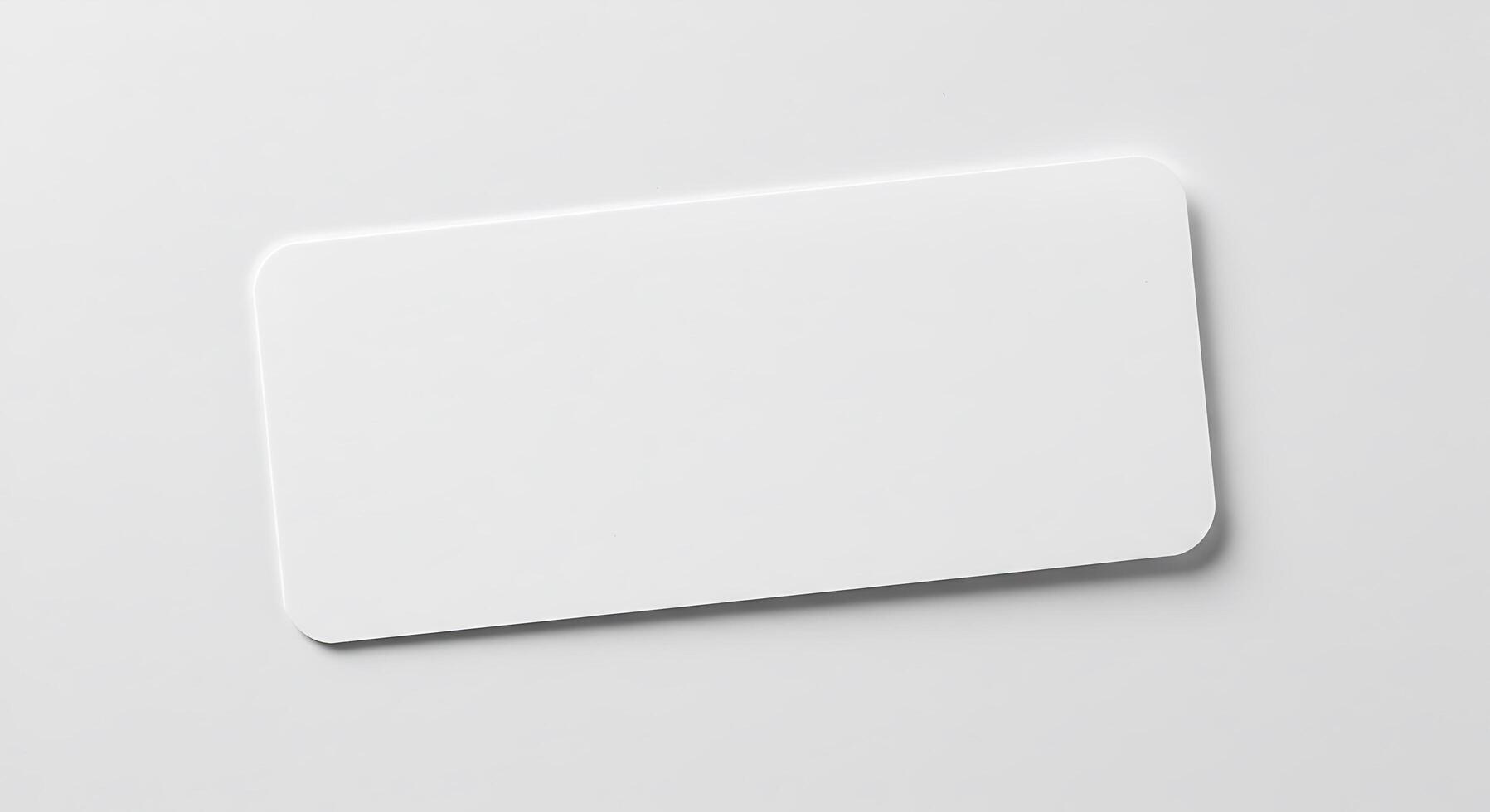 Blank white card on a white surface photo