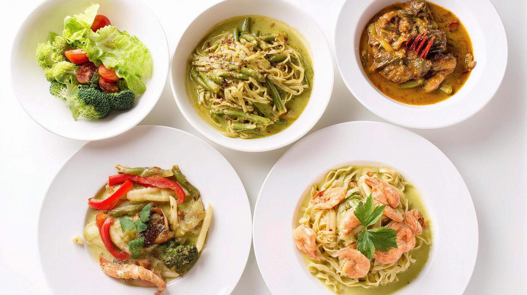A set of four white plates with different types of food photo