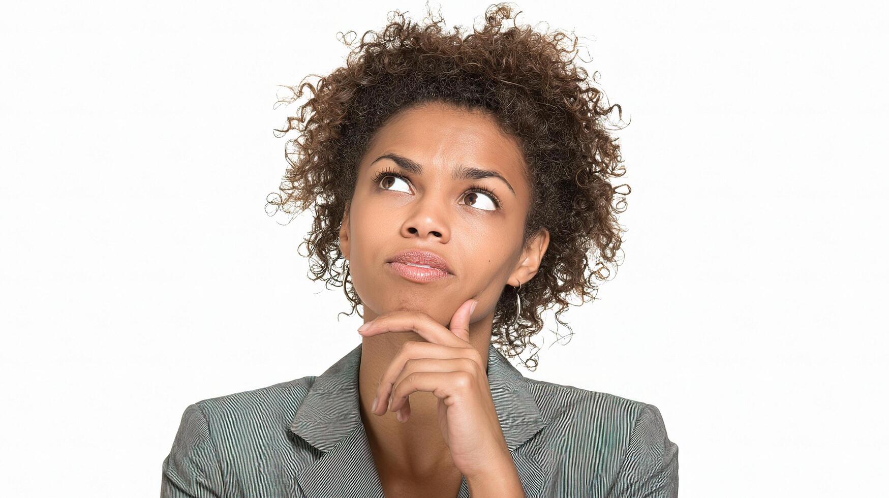 A woman with curly hair is thinking photo