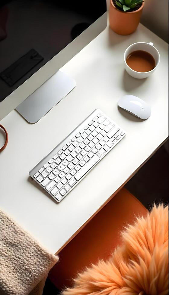A desk with a keyboard, mouse, and a mug of coffee photo