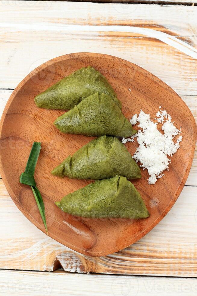 Apang Panas Bugis with Pandan. Steamed Cake Made from Rice Flour with Coconut photo