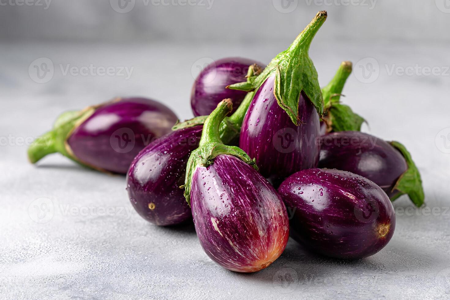 tempting eggplant in the rustic corner on a light gray background photo