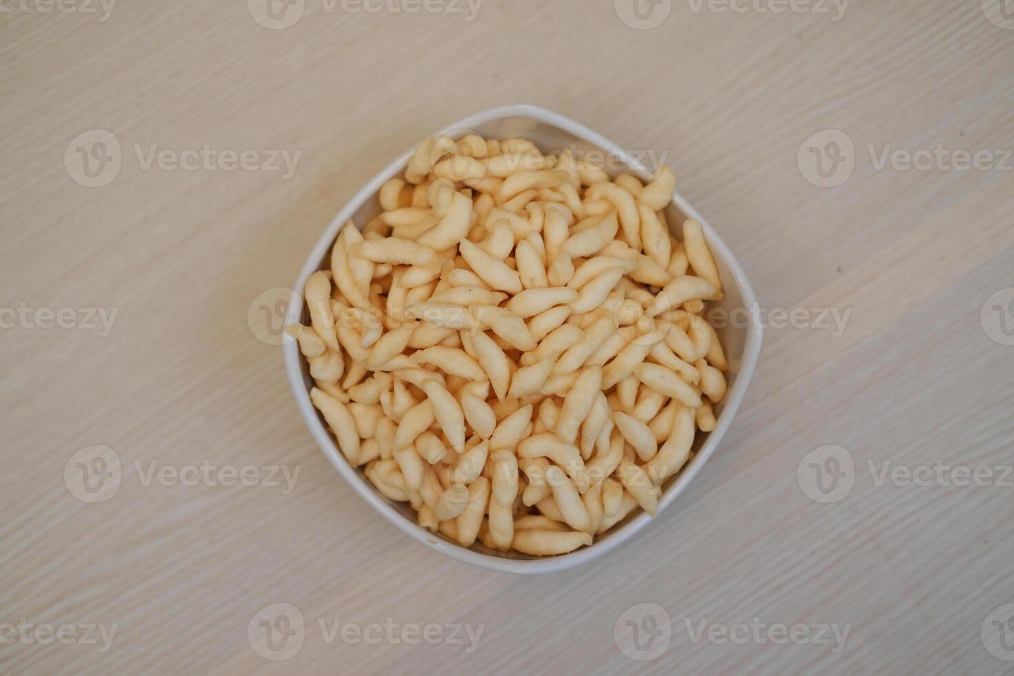 The snacks have a crunchy appearance and are uniformly shaped photo