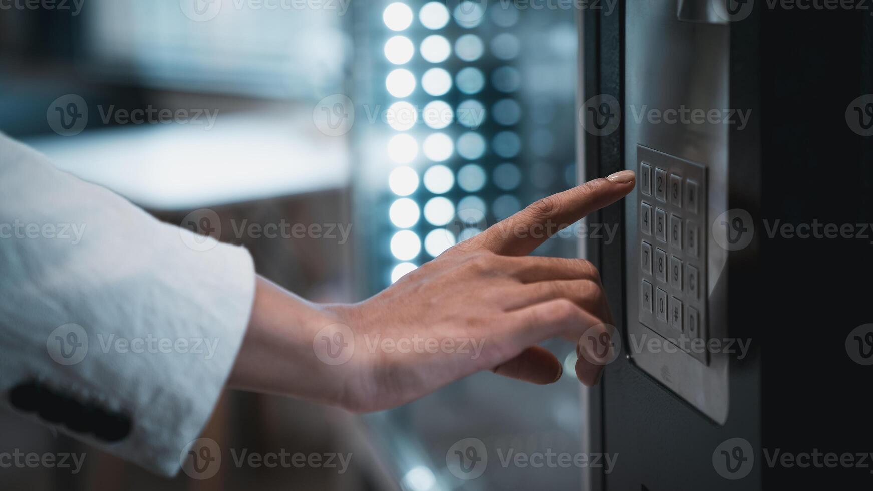 A person is touching a button on a vending machine photo