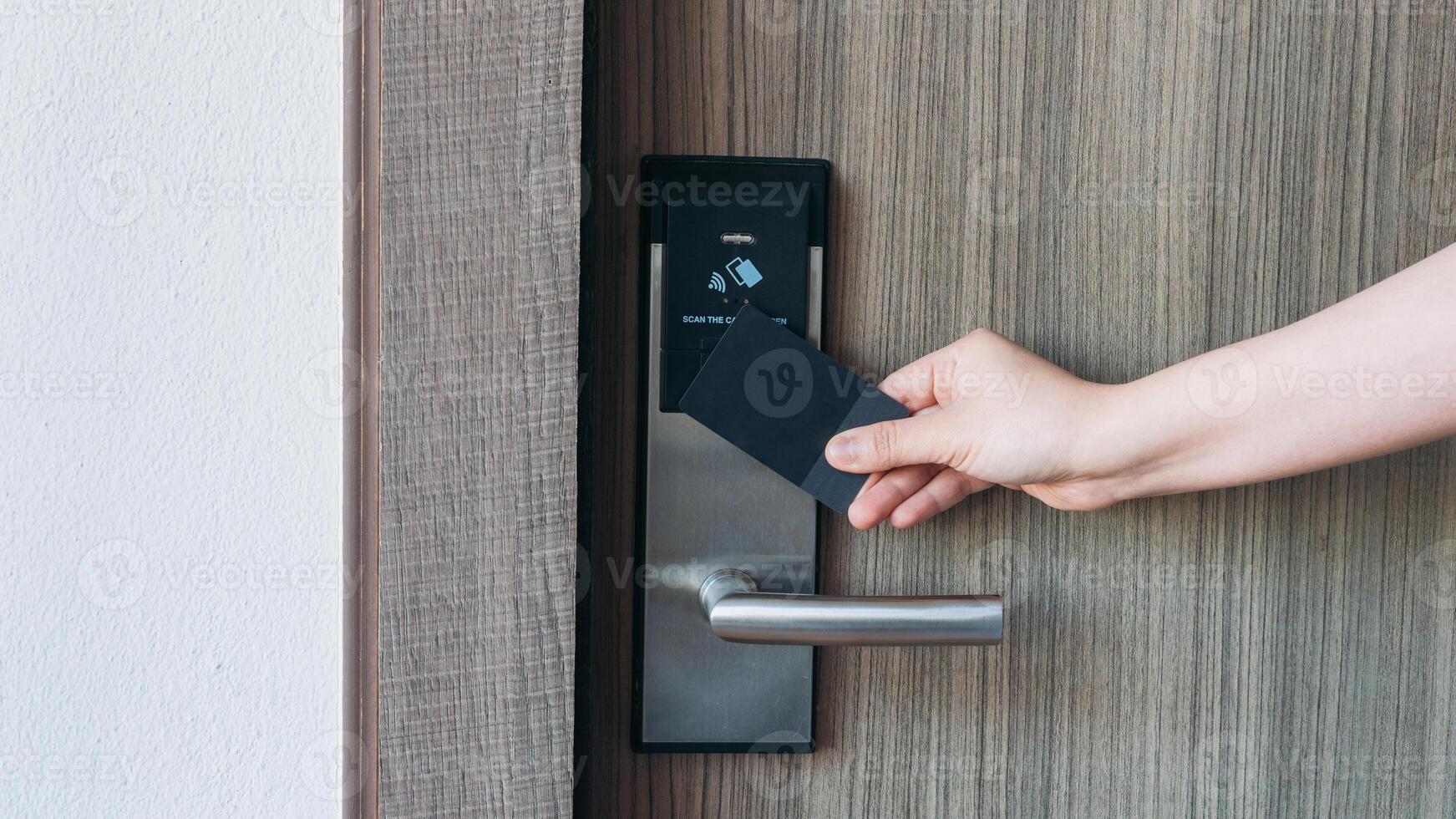 A person holding a card to open a door photo