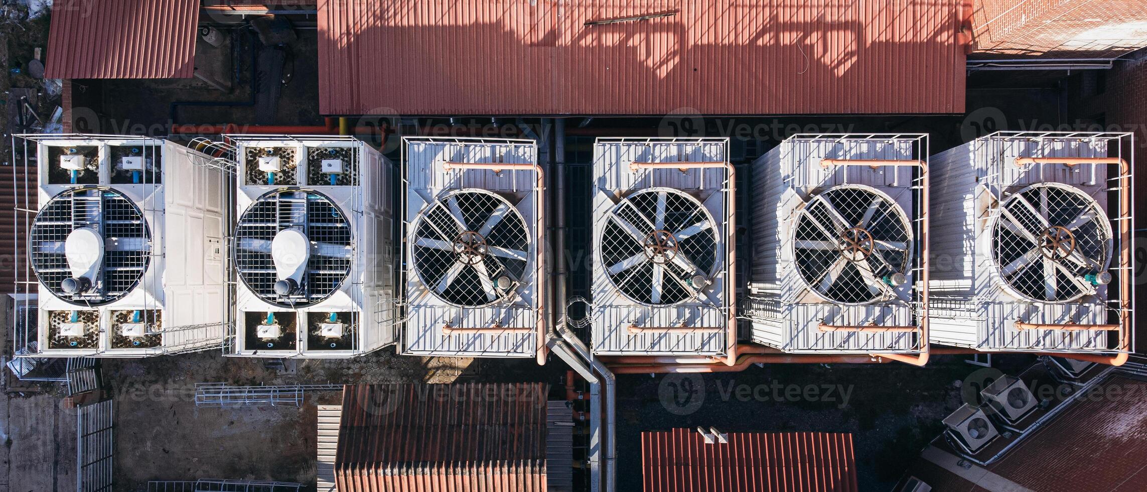 An overhead view of a warehouse with several air conditioners photo