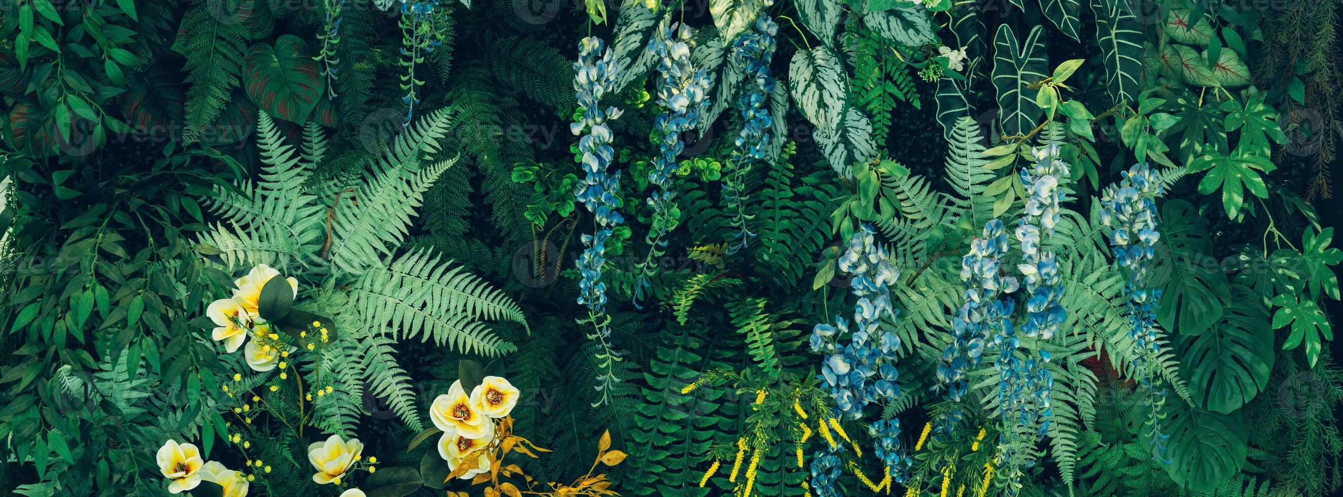 A painting of a jungle scene with flowers and plants photo