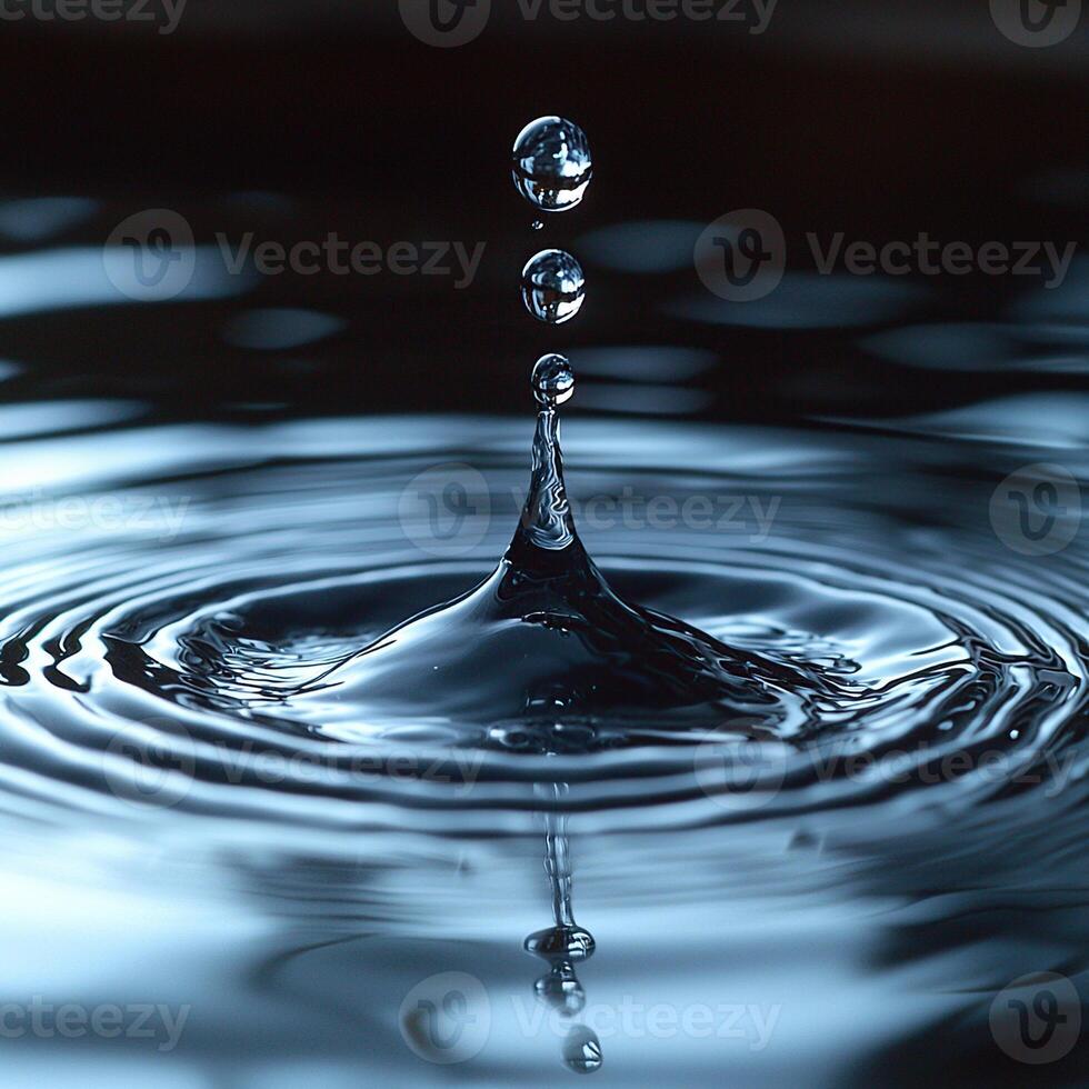 Captivating macro shot showing water droplets creating ripples on the tranquil water surface. photo
