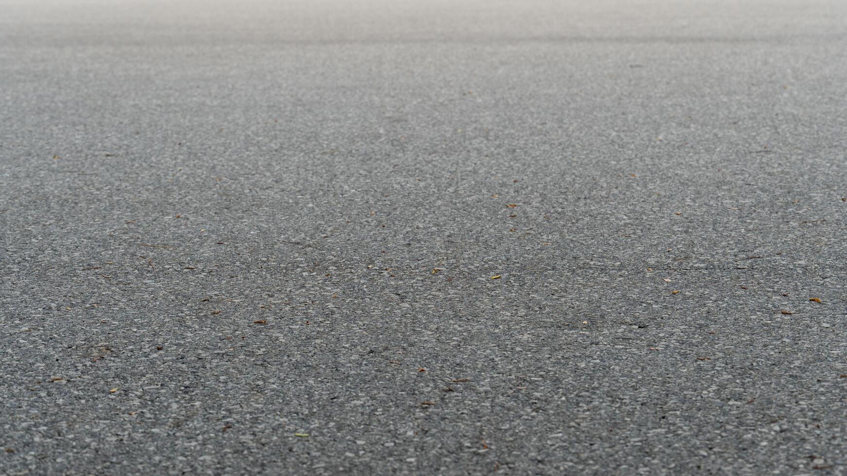 Shallow focus view of asphalt road surface. For background and textured. photo