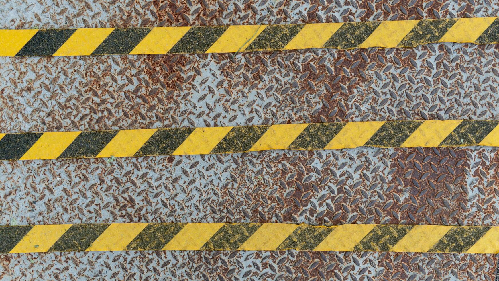 Steel floor panels used as walkways. There are black and yellow lines to prevent slipping on top. For background and textured. photo