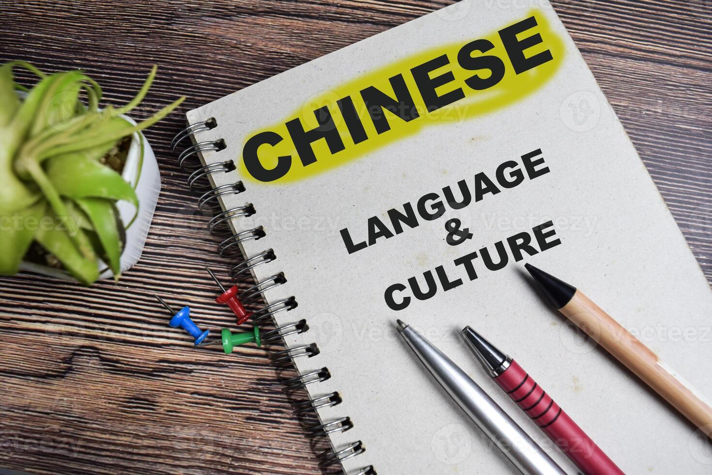 Concept of Chinese - Language and culture on book isolated on Wooden Table. photo
