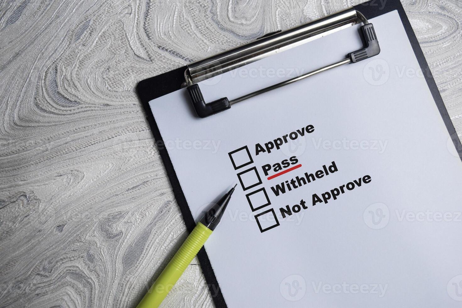 Concept of pointing pass and underlined in red color write on paperwork isolated on Wooden Table. photo