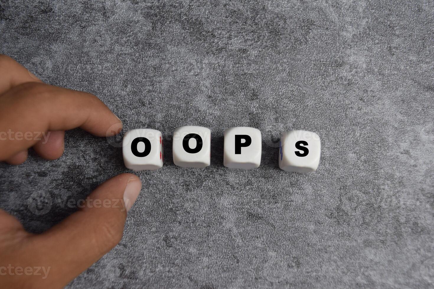 male hand placing the wooden cubes with the word on the table. apologize for a mistake or error photo
