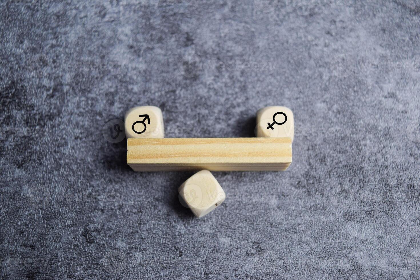 Concept of gender equality. wooden blocks with male and female symbol on balanced seesaw photo