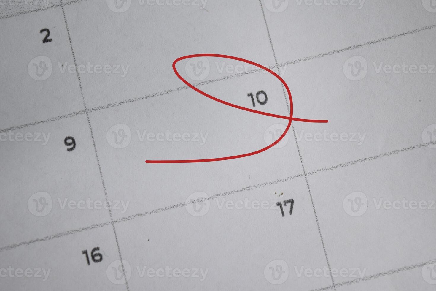 Focus on number 10 in calendar and emptyred ellipse. Save the date. Day of the year concept. photo