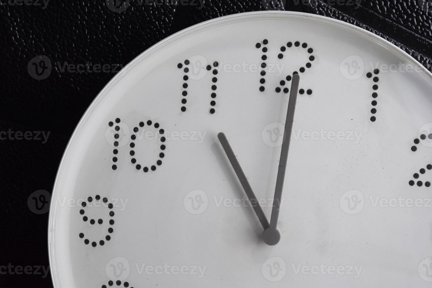 Focus time in clock of eleven o'clock for design in your business concept isolated on black background photo