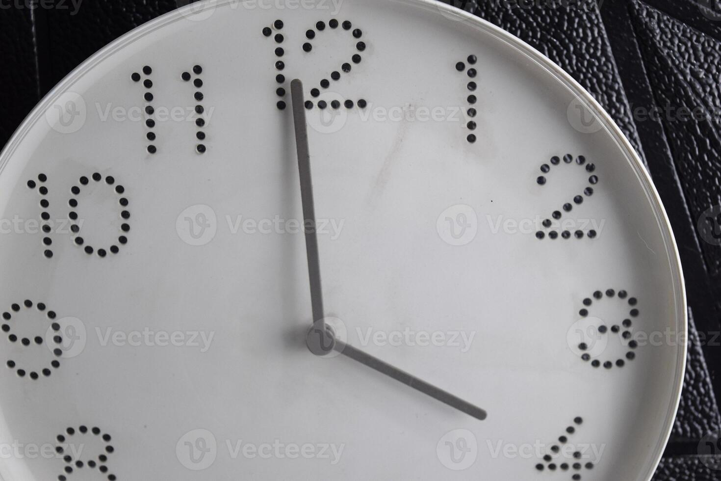 time in clock of four o'clock for design in your business concept isolated on black background photo