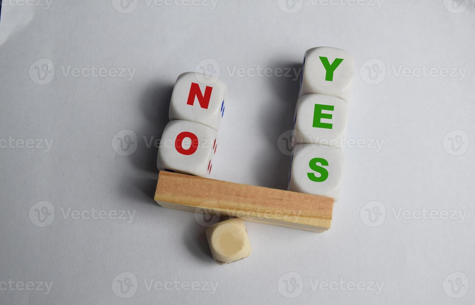Yes or No inscription on wooden cubes on a seesaw with yess outweight no. The concept of positivy or positive attitude in life photo