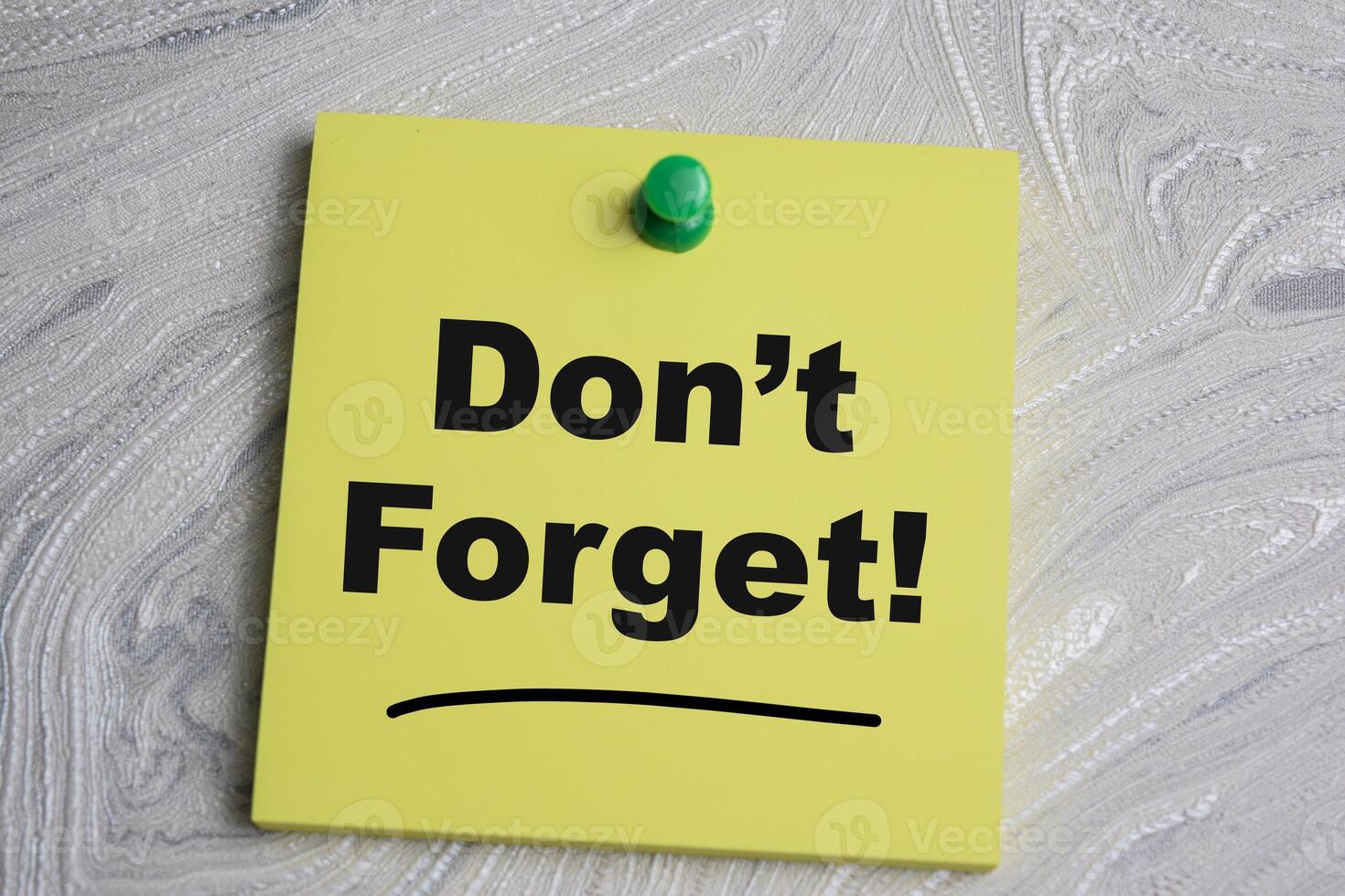 Concept of Dont forget write on sticky notes isolated on Wooden Table. photo