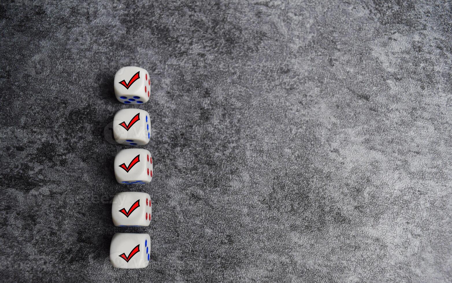 Wooden cubes or dice with check mark on the table. Checklist concept photo