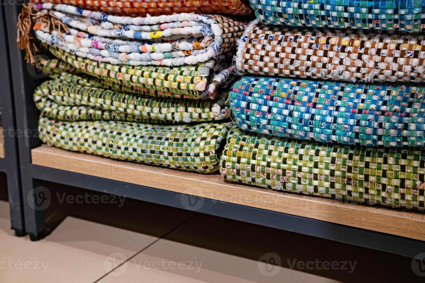A woven rug made of old things. Eco-friendly development. Reuse of items. Handmade work. photo