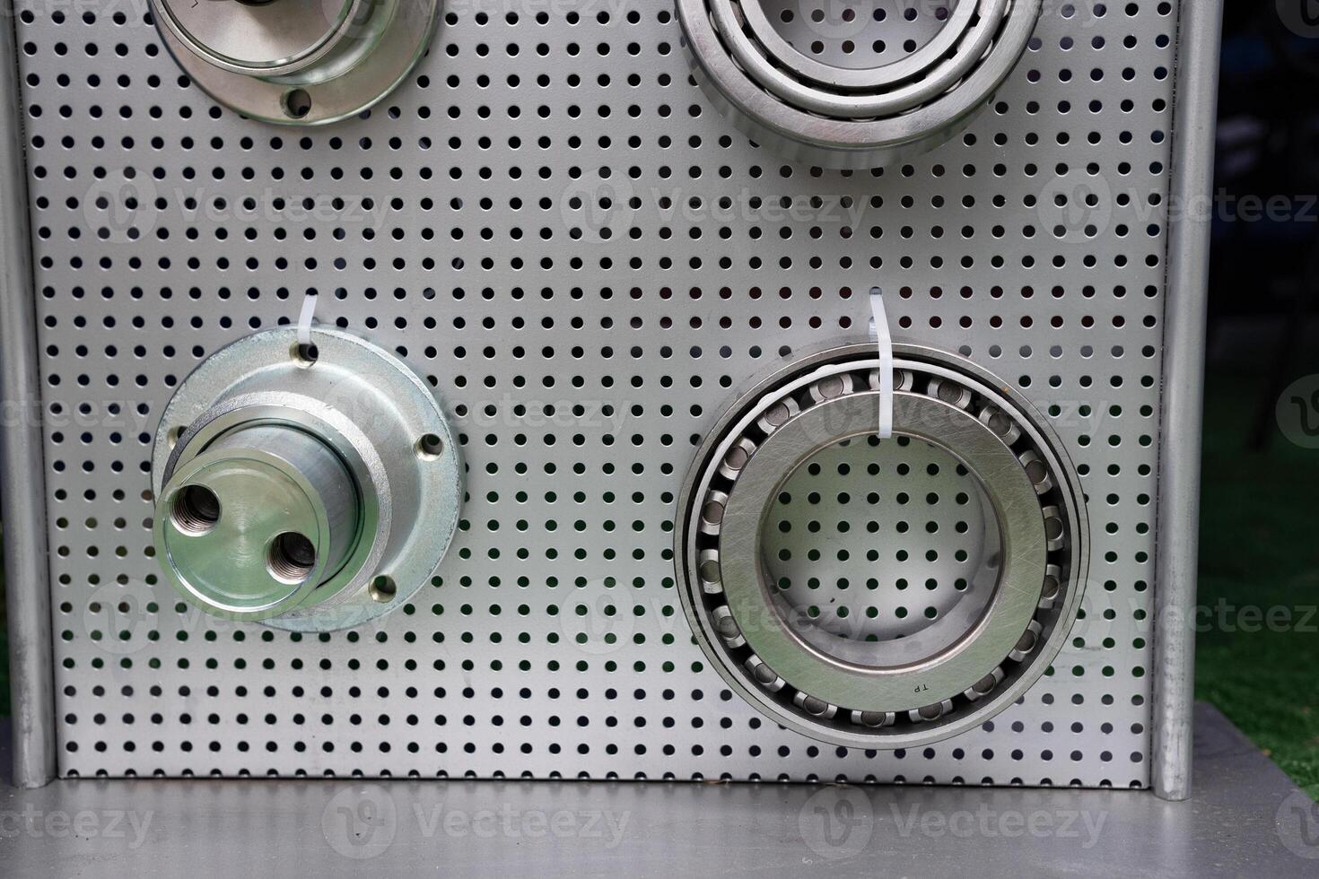 different bearings on a metal background. Part of mechanism micrometer. photo