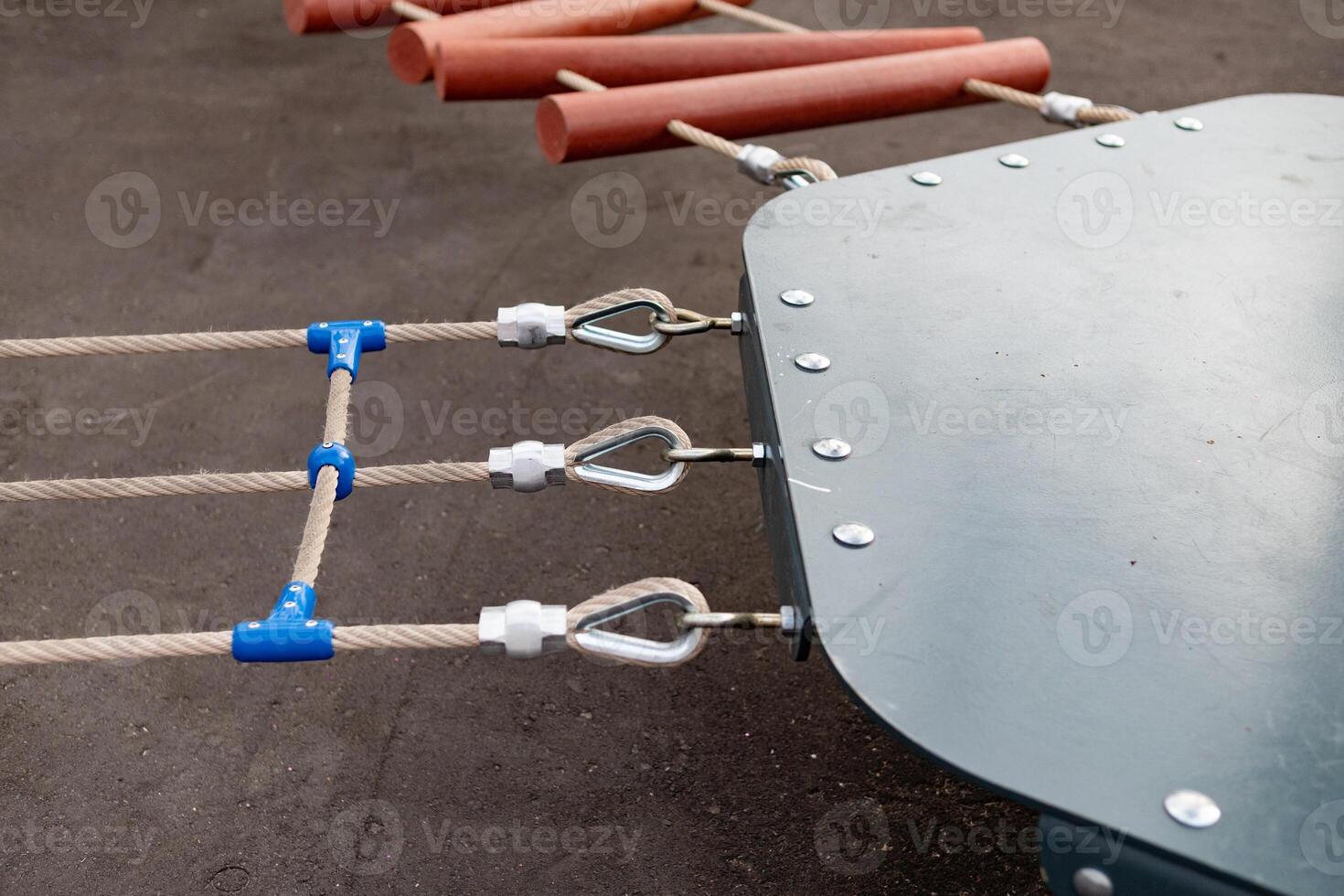 Steel turnbuckle and sling steel or Steel Wire Rope Sling and metal cable clamp connected with screw bolt. Device for adjusting the tension or length of cable on a blue sky background. Copy space. photo
