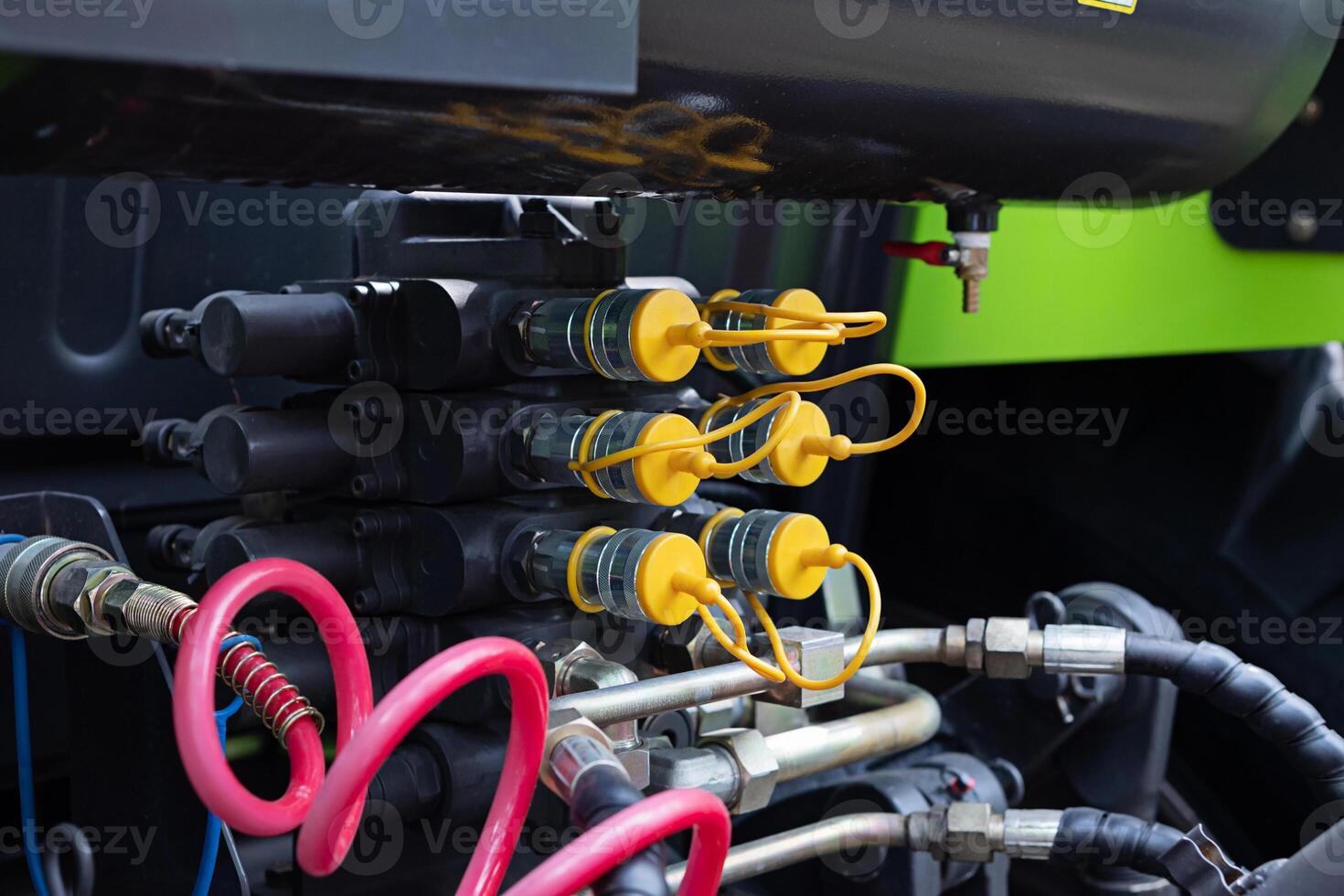 Hoses of modern hydraulic machine. Machinery work. photo