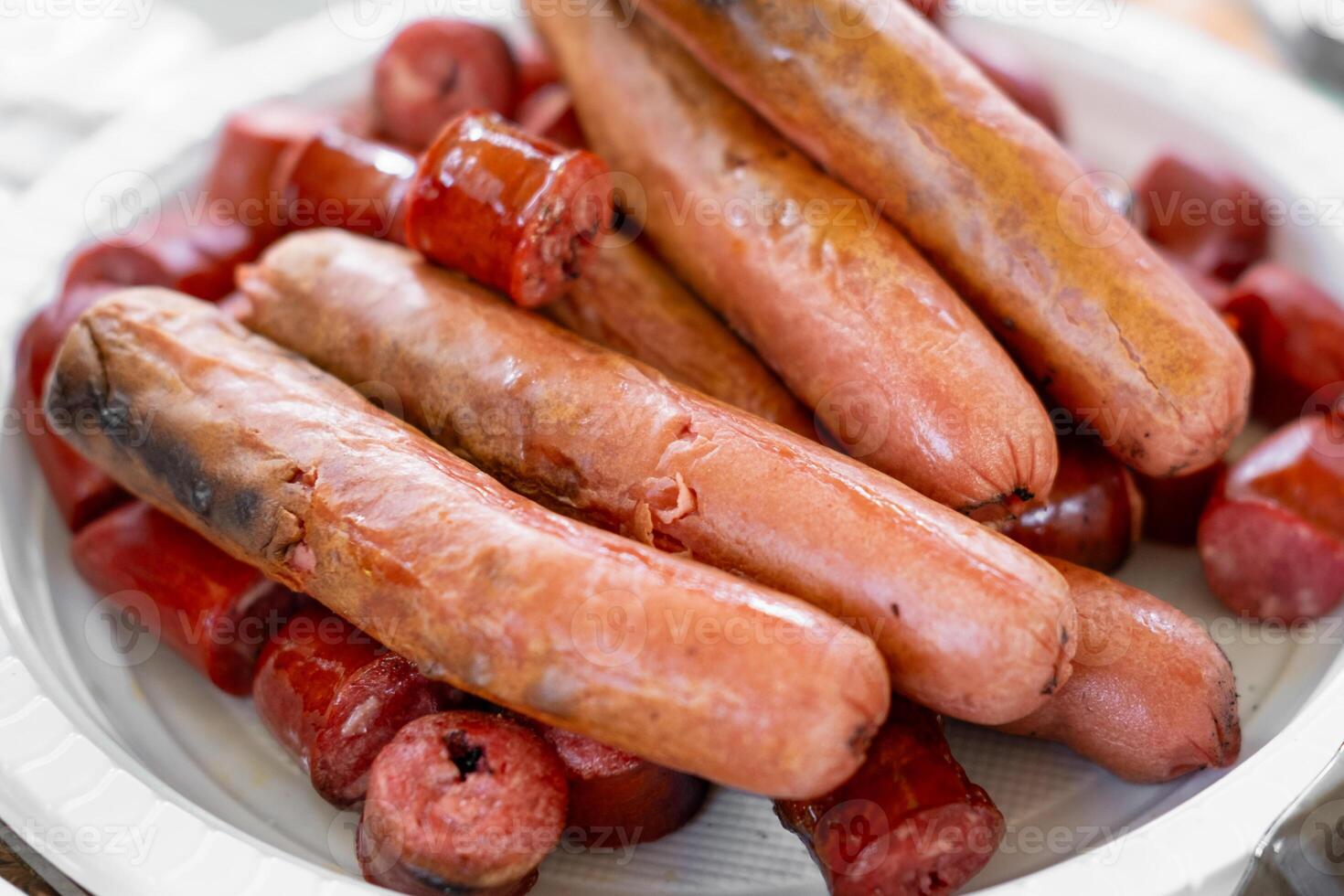 grilled sausages on a white plate, grilled close-up photo