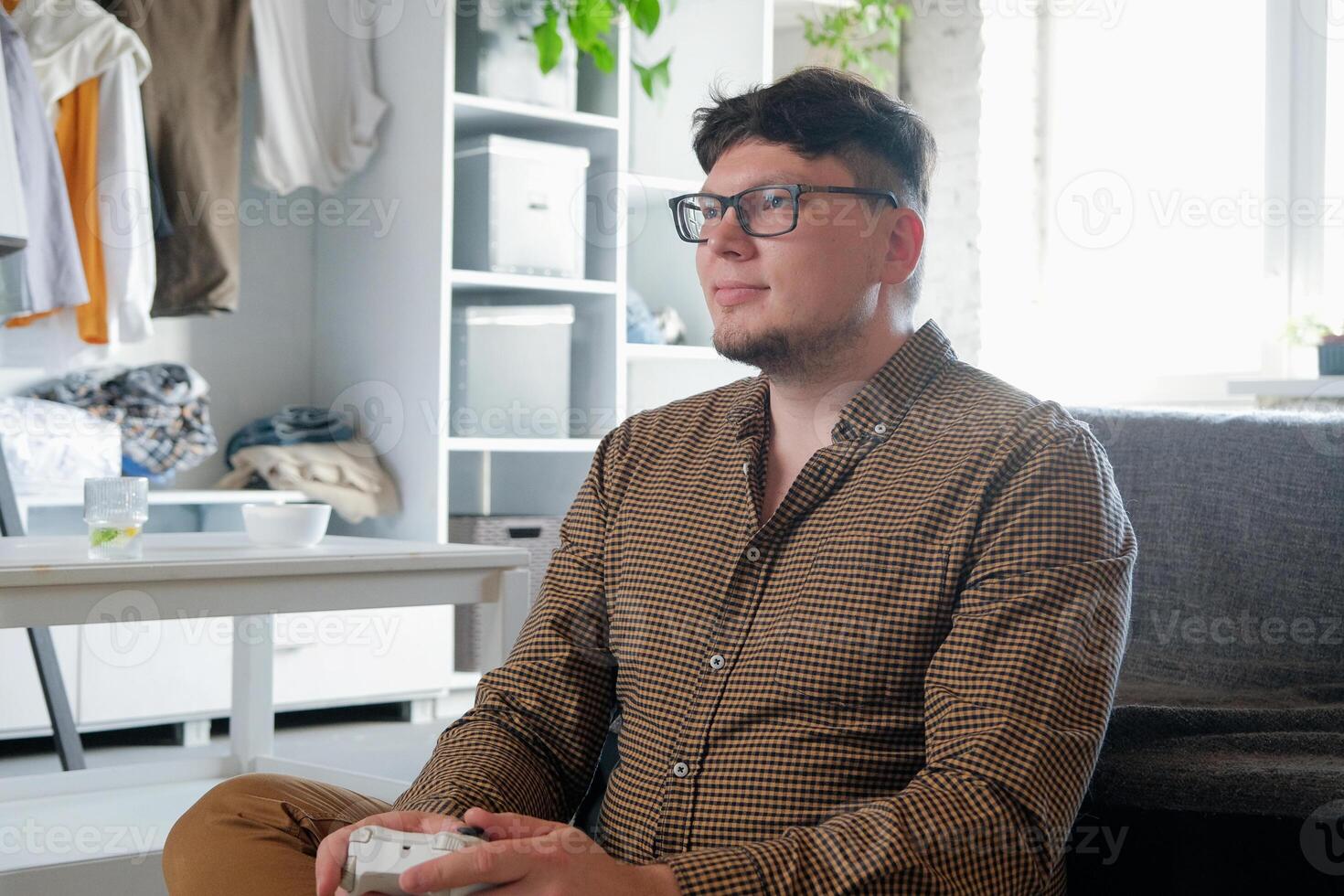 Caucasian man playing games using controller photo