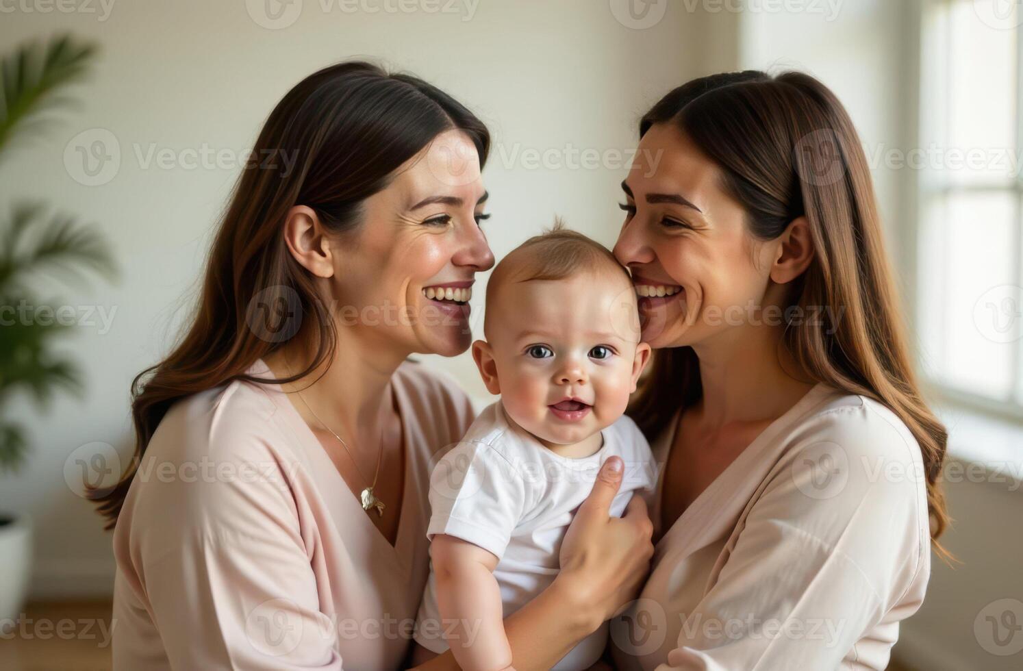 two mothers lesbians couple and baby smiling together at home. LGBT Pride month . photo