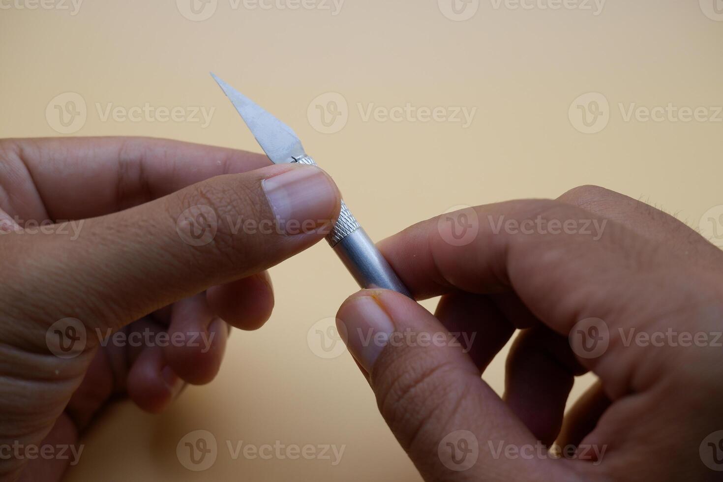 Hobby Knife Tool Gripped and Ready for Cutting Tasks photo