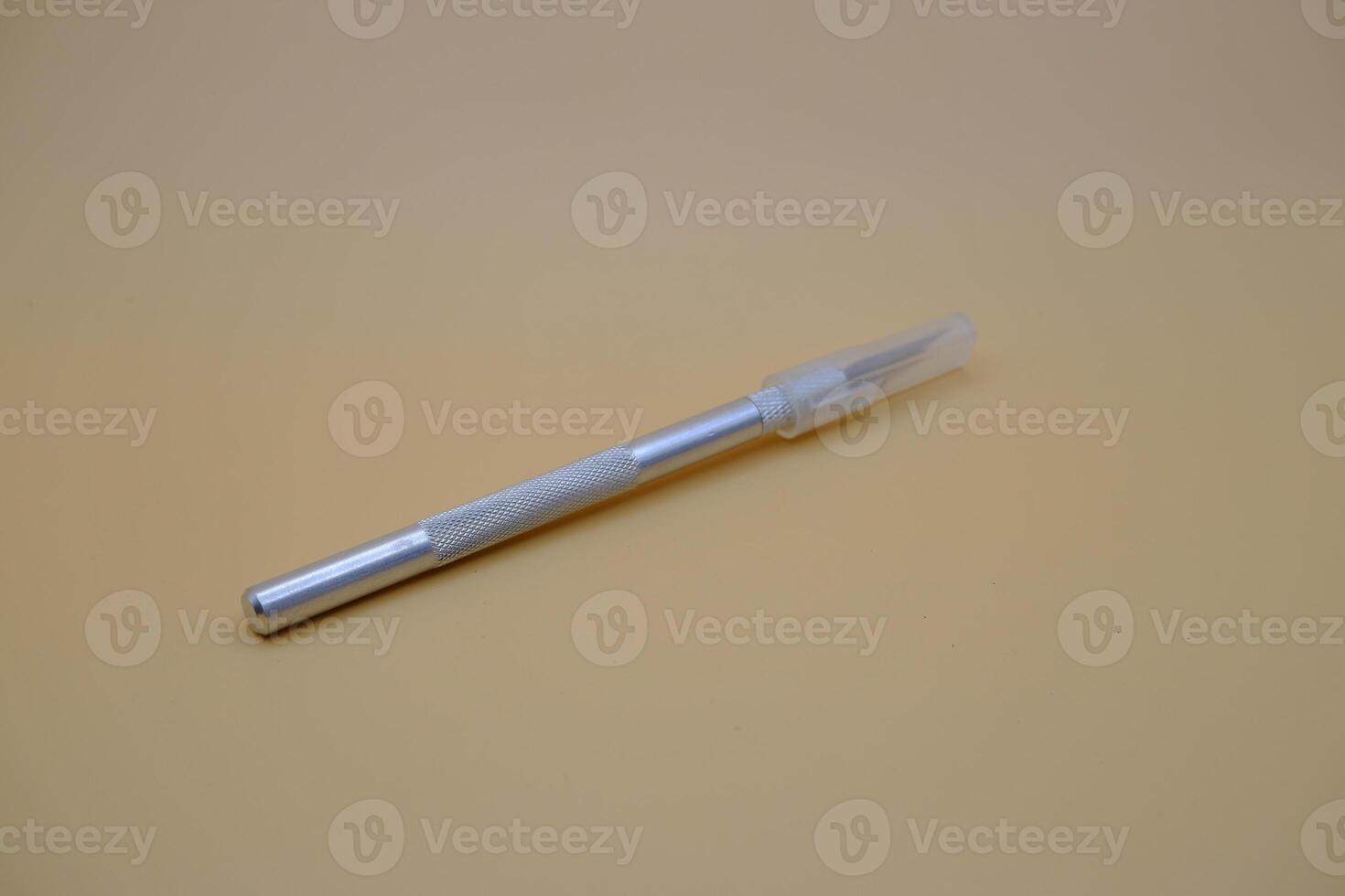 Utility Knife with Metal Handle and Transparent Cap photo