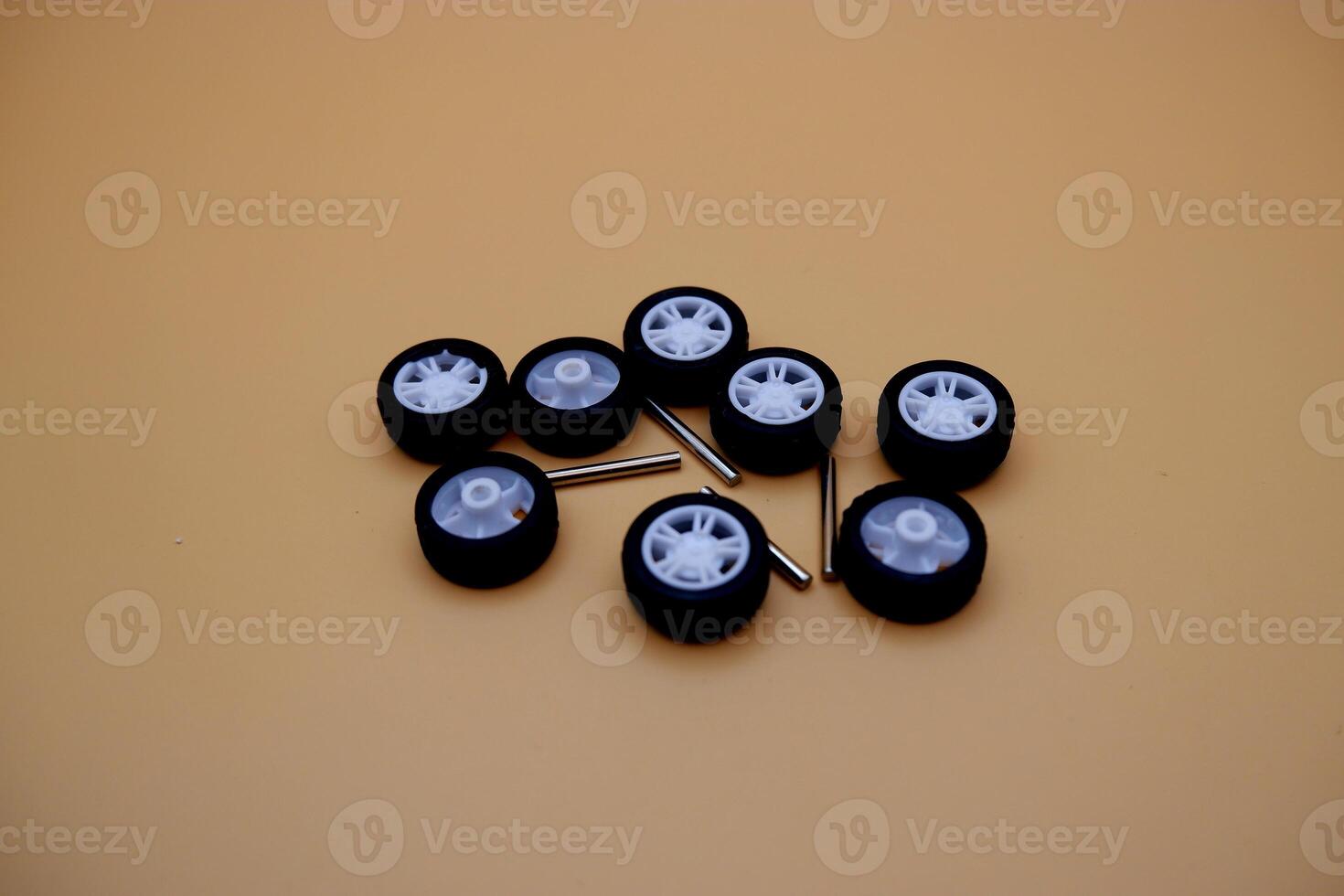 Assorted Miniature Toy Car Wheels on Flat Surface photo