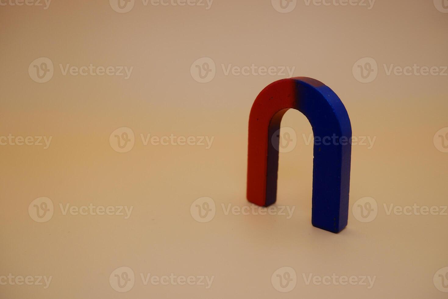 U Shaped Red and Blue Magnet on Neutral Background photo