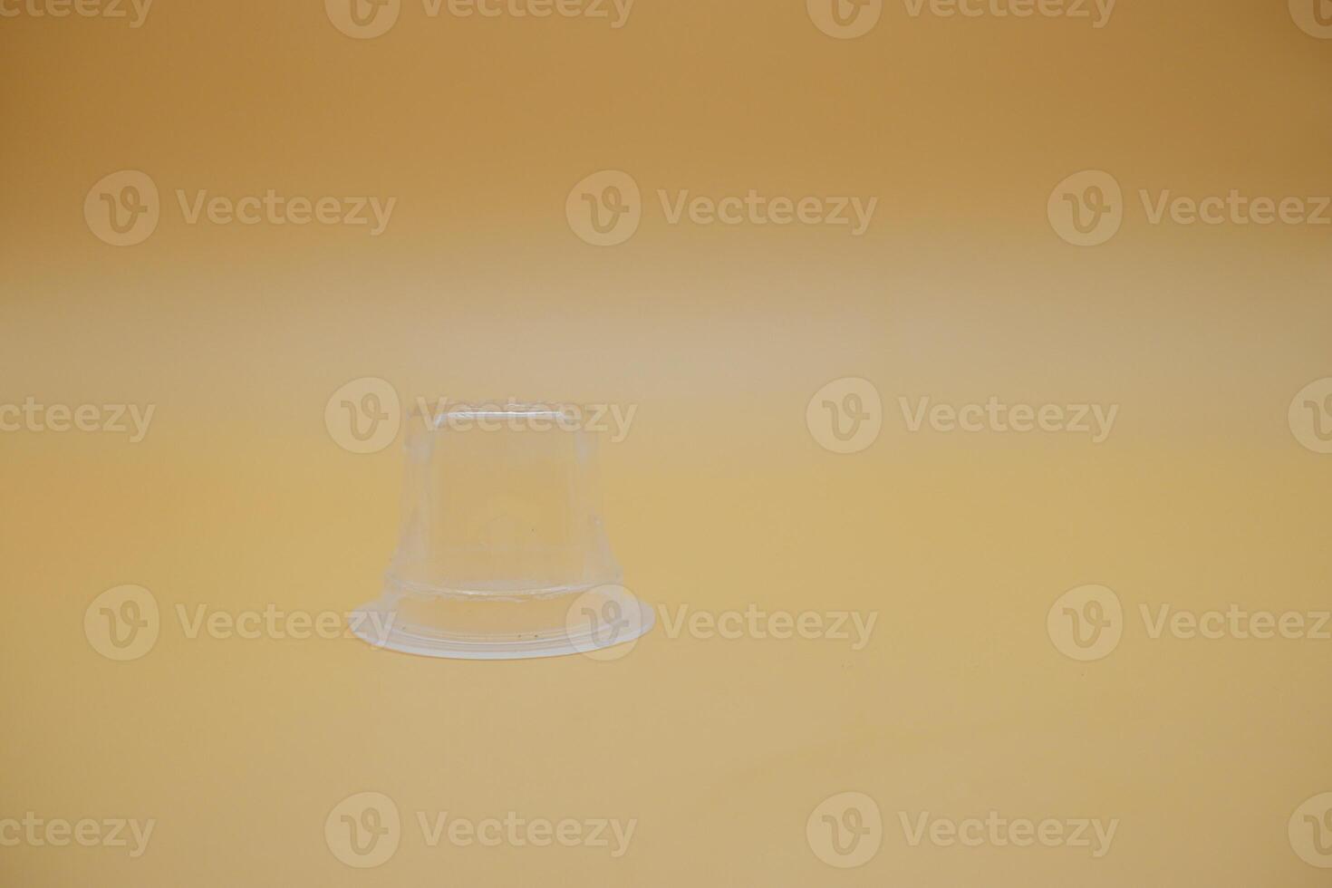 Disposable Plastic Jelly Container Isolated on Plain Surface photo