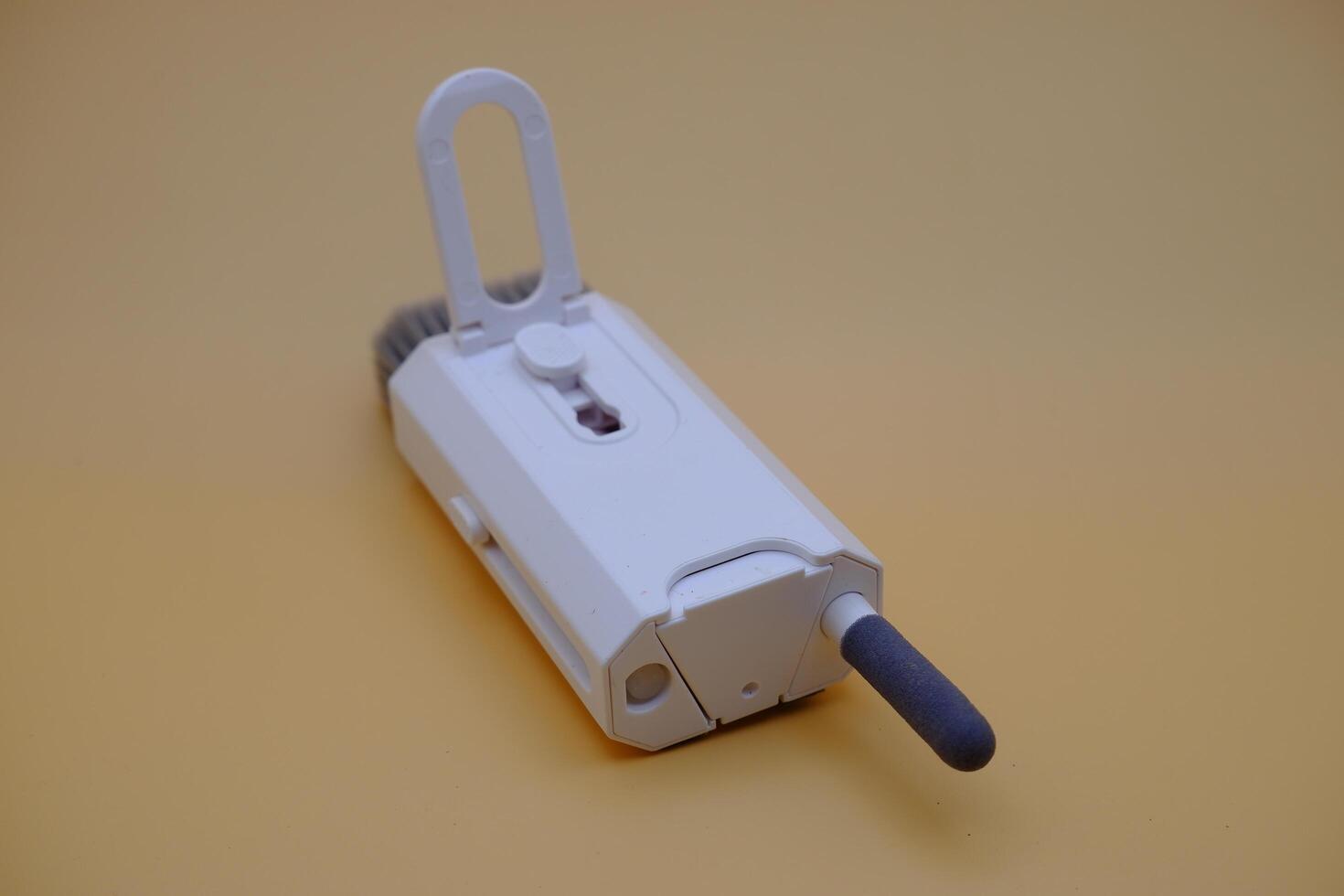 Portable Cleaner for Gadgets Brush Swab, and Spray, in One Tool photo