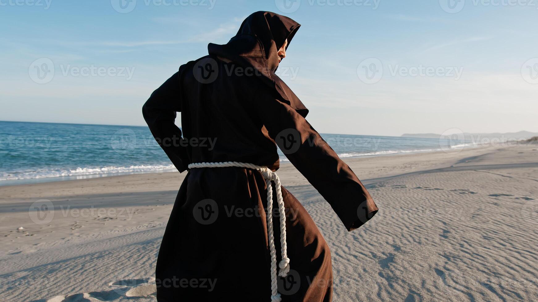 Monk Practising Martial Arts At The Beach photo