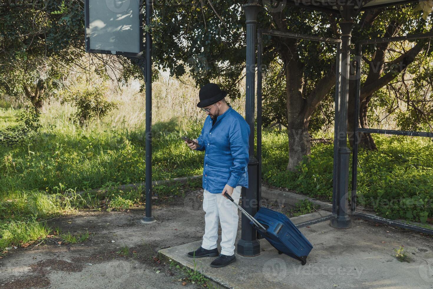 Man Checking The Smartphone At The Station photo