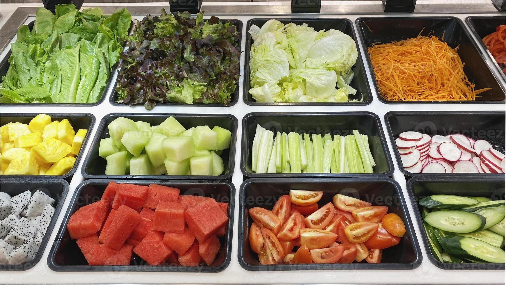 Fresh Vegetable and Fruit Salad Bar Display also included melon, watermelon, tomatoes, celery, beetroot, cabbage, pineapple, dragon fruit, carrot, cucumber photo