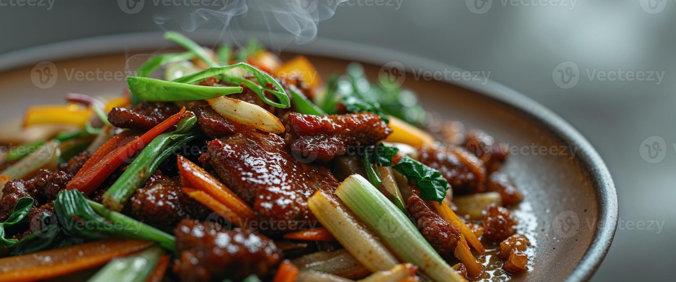 A plate of stir fried meat and vegetables photo