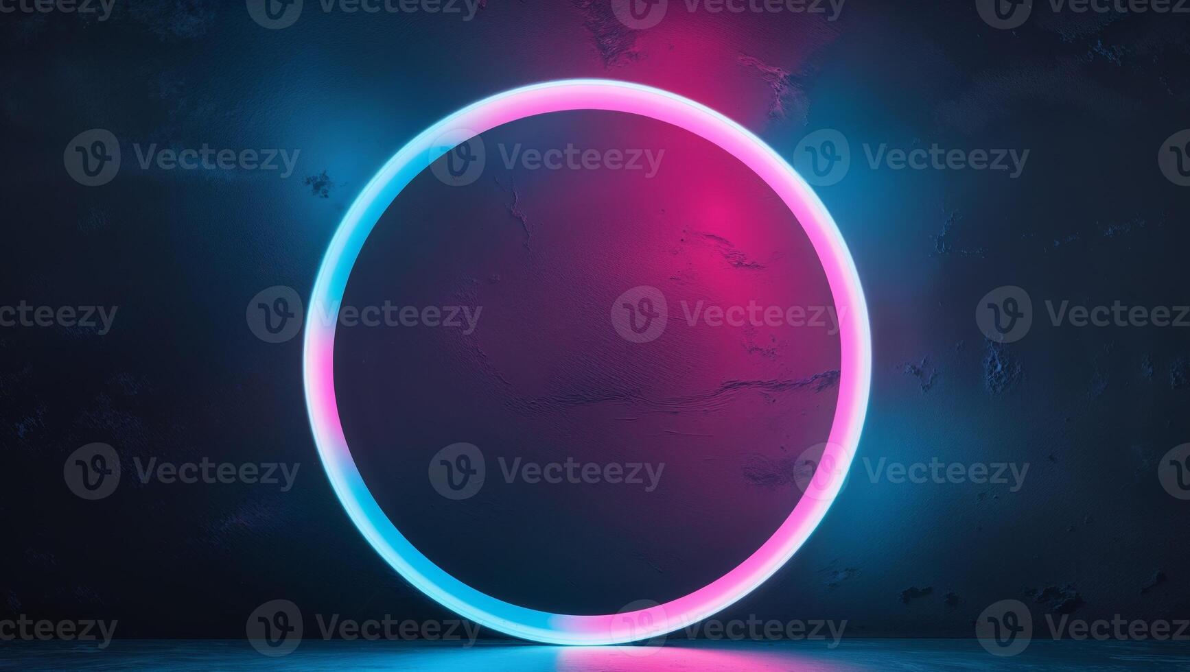 Glowing neon circle with pink and blue gradient on dark background photo