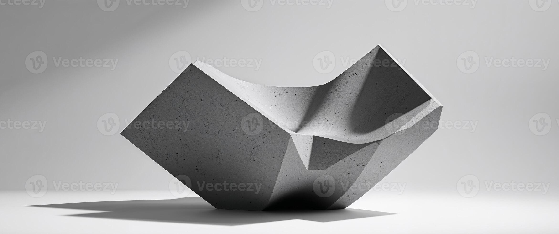 A sculpture made of concrete that is sitting on a table photo